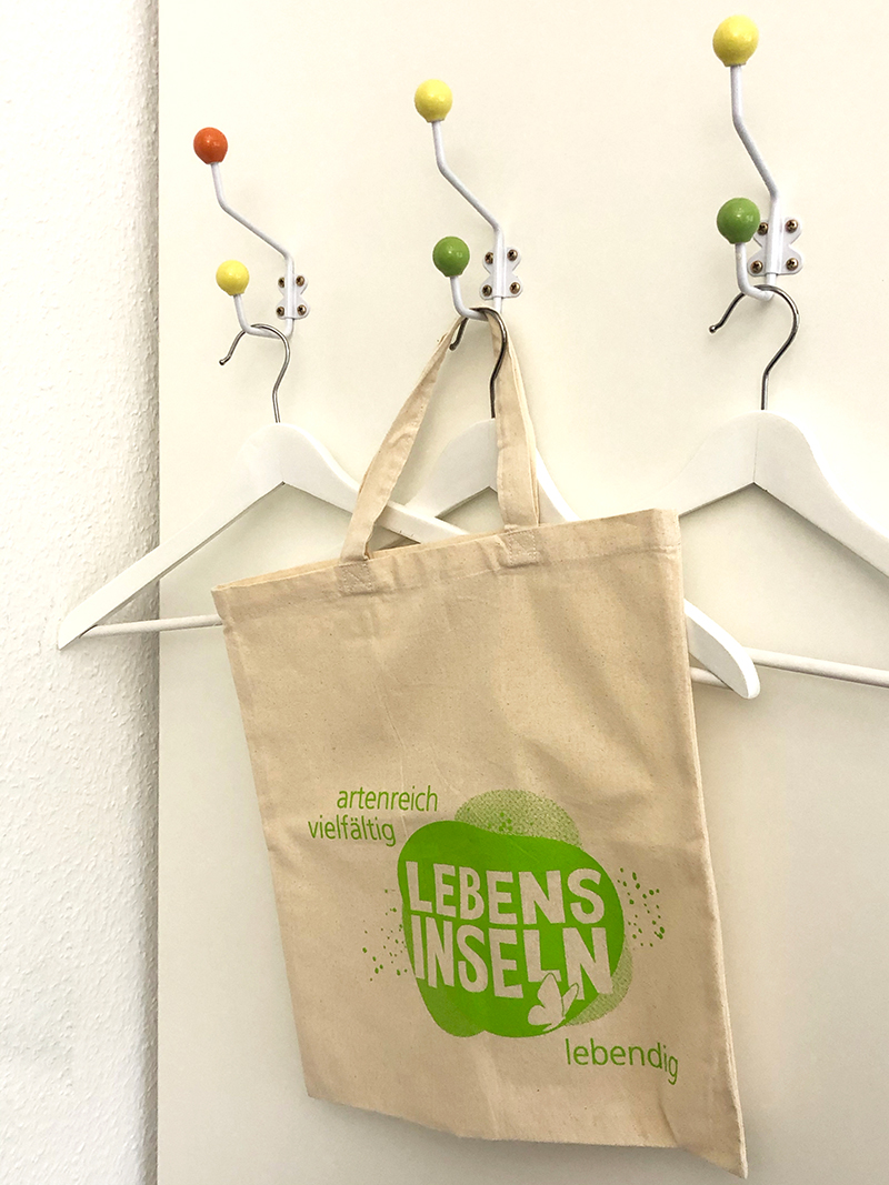 Tragetaschen aus Bio-Baumwolle mit dem Lebensinsel-Logo